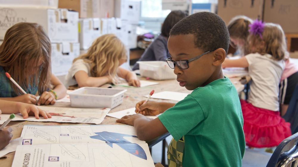 Children in a classroom at the start of the school year
